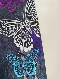 Women yoga pants fabric detail butterfly print slim stretchy fitness activewear close-up view