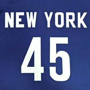 Close-up detail of blue kids sportswear fabric featuring bold white New York text and number 45.