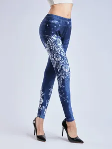 High waist floral print faux denim leggings detail view, stretchy slim fit casual pants.