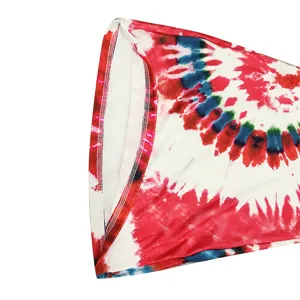 Close-up of women's tie-dye flare pants fabric featuring vibrant red, white and blue pattern.