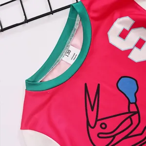 Kids athletic sportswear jersey detail view showing colorful collar and fun print design.