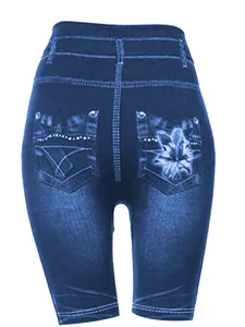 High waist faux denim leggings detail showing back pockets, fake stitching and floral print.
