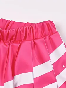 Detailed close-up of vibrant pink cheerleader skirt featuring white stripes and elastic waist.
