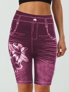 High-waisted faux denim shorts with floral print, slim stretch casual wear for women.