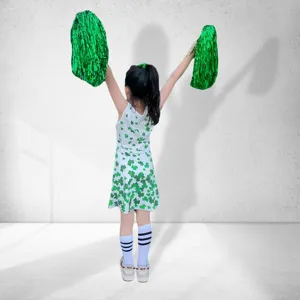 Kids cheerleading dress set with green clover print, sleeveless performance outfit for girls.