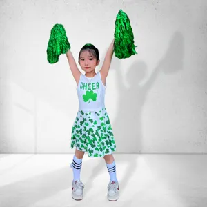 Details of children cheerleader uniform featuring clover print, sleeveless top, and matching skirt.