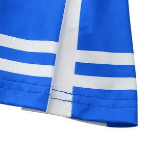 Close-up detail of children performance costume skirt hem blue white striped fabric