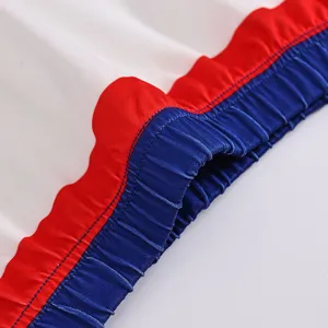 Close-up detail of children cheerleading costume elastic waistband and colorful fabric