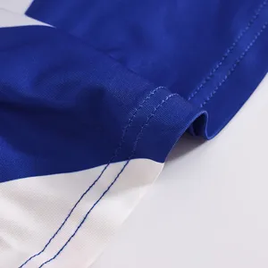 Close-up of blue white cheerleading uniform fabric texture and double stitching details.