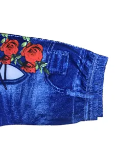 Detail view of women floral print fake denim shorts elastic high waist tight leggings style.