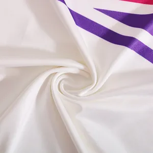 Cheerleader costume fabric detail, white material with purple pink stripes close up texture.