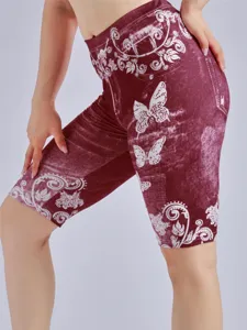 Detail view of wine red high waist shorts featuring stylish faux denim print and cute white butterflies.