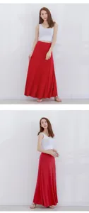 Close up details of the high waist red maxi skirt and white crop top set on model.