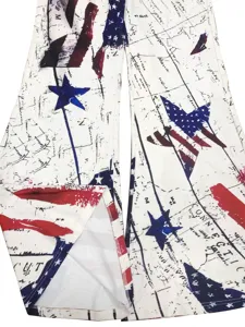 Close-up detail of women's vintage American flag map print flared pants fabric and hem pattern.
