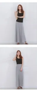 Detailed view of the casual black tank top and grey maxi skirt set worn by model.