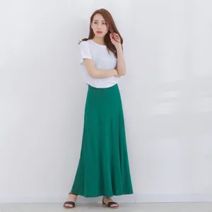 Casual women solid color short sleeve t-shirt paired with high waist long green skirt