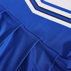 Cheerleading uniform fabric detail showing blue pleated skirt and white chevron stripes.