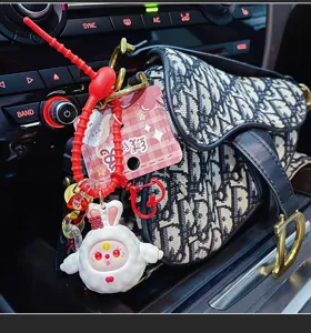 Cute plush rabbit keychain pendant for keys and bags, stylish cartoon couple accessory design.