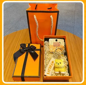 Wooden carved dog family keychain set with luxury orange gift box and bag for gifts.