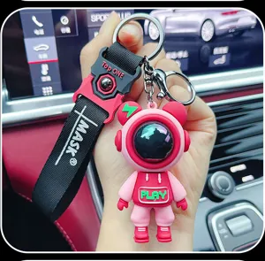 Detailed view of the trendy astronaut bear keychain with stylish strap and metal ring.