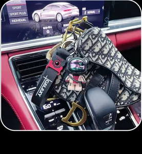 Cool astronaut bear keychain with stylish strap, perfect car key ring and bag charm accessory.