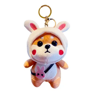 Cute Shiba Inu plush keychain with rabbit hoodie, soft stuffed animal backpack pendant gift.