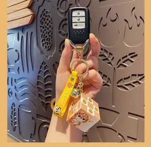 Mini Rubik's cube keychain with cute cartoon tiger pendant and car key fob decor.