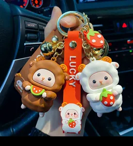 Cute cartoon sheep keychain detail featuring cute silicone fruit charms and metal ring.