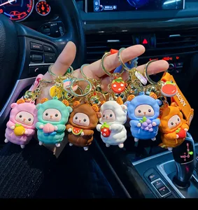 Cute cartoon sheep keychain with fruit charms, trendy epoxy resin doll bag pendant for women.