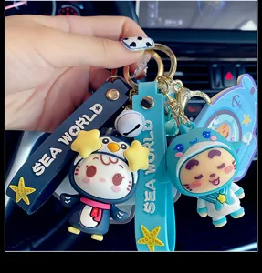 Cute ocean series cartoon keychain with cute penguin and shark charms for bag car keys.