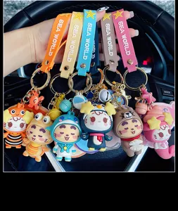Cute cartoon marine animal keychain set with silicone straps and metal rings for bags.