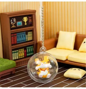 Cute cat gachapon keychain detail view showing the miniature acrylic ball charm ornament.