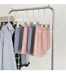 Details of the summer home shorts hanging on rack with side split and elastic waist.