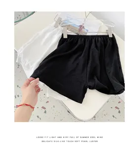Detail shot of summer loose home shorts with side slit, silky lightweight fabric texture.