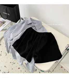 Detail view of a light blue shirt and black home shorts set, soft and comfortable for daily wear.