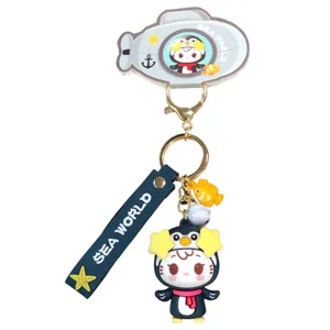Cute cartoon sea series keychain with submarine and penguin pendant for car keys and bags.