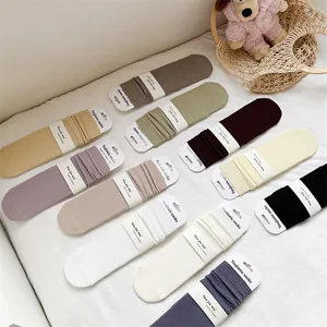 Comfortable solid color ribbed cotton women mid-tube socks with heel for autumn winter.