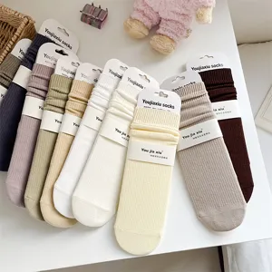 Solid color ribbed cotton mid tube women socks with heel detail, comfortable everyday wear.