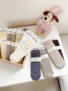 Women ribbed cotton mid-tube socks with heel design, cozy autumn winter solid color socks.