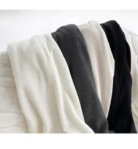 Detailed view of women's thermal base layer shirts in multi-colors with soft ribbed fabric.