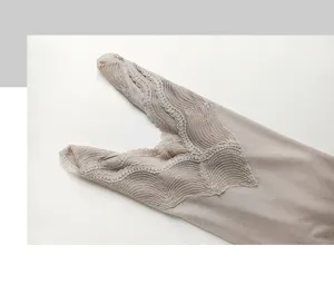 Close-up detail of women thermal top featuring delicate lace V-neck trim in elegant khaki.