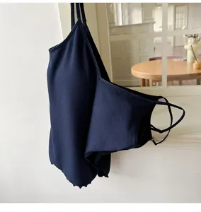 Detail view of a dark blue ribbed camisole with built-in bra cups and V-neck design for women.