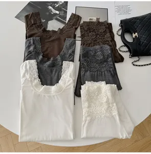 Detailed view of women's thermal underwear set with elegant lace trim, slim fit base layer.