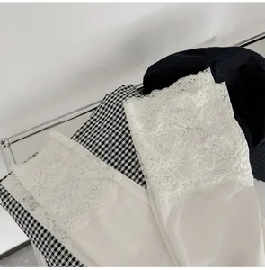 White lace thermal underwear detail view, cozy fabric, autumn winter inner wear layer for women.