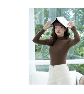Women brown ribbed turtleneck thermal top detail view, slim fit long sleeve base shirt.