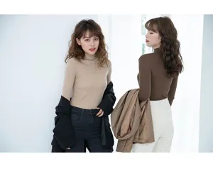 Detail view of women's ribbed turtleneck thermal top, soft stretchy basic layer sweater.