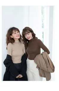 Detailed view of women slim ribbed turtleneck sweater, soft knit fabric for cozy daily wear.