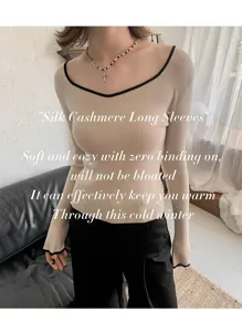 Detail view of the soft silk cashmere long sleeve top featuring a chic seagull neckline.