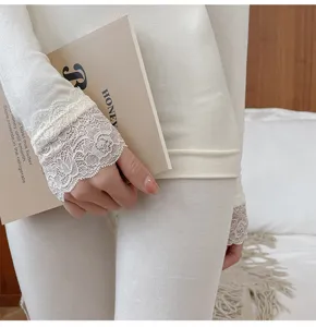 Close-up detail of women thermal underwear featuring delicate lace cuffs and seamless fit.