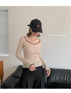 Detail view of women's autumn winter silk cashmere long sleeve slim fit beige U-neck sweater.